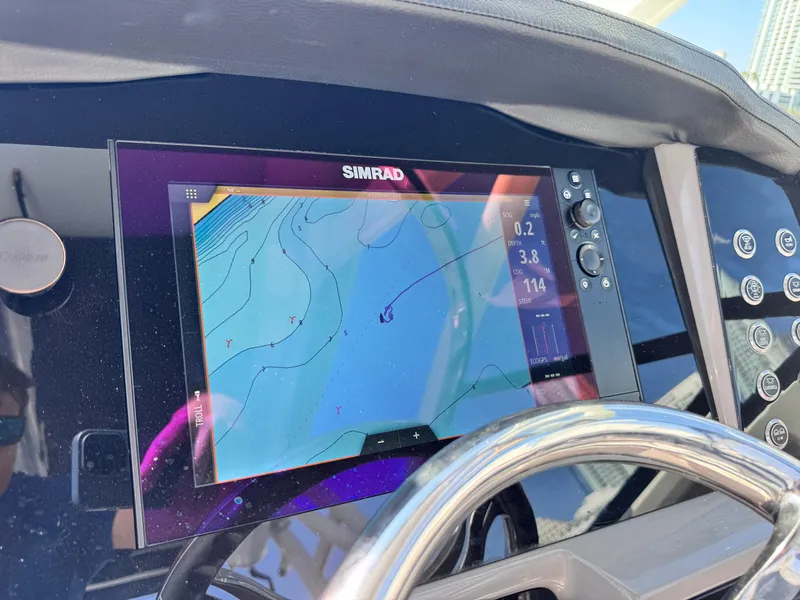 Slide: The Image of Simrad navigation display on 2021 Robalo R317 Dual Console boat dashboard. - 26