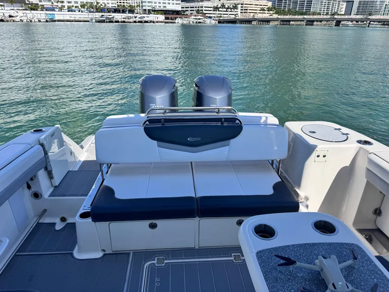 Slide: The Image of 2021 Robalo R317 Dual Console boat interior with seating and ocean view. - 29