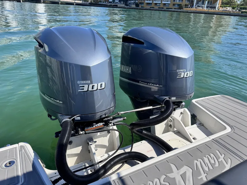 Slide: The Image of Twin Yamaha 300 engines on a 2021 Robalo R317 Dual Console boat. - 37