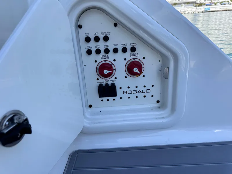 Slide: The Image of Control panel of 2021 Robalo R317 Dual Console boat with switches and dials. - 45
