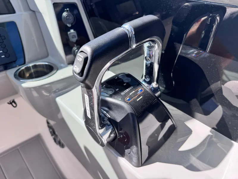 Slide: The Image of Throttle control of 2021 Robalo R317 Dual Console boat, featuring modern design. - 48