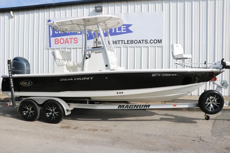 Slide: The Image of 2017 Sea Hunt BX22BR boat on trailer outside dealership. - 1