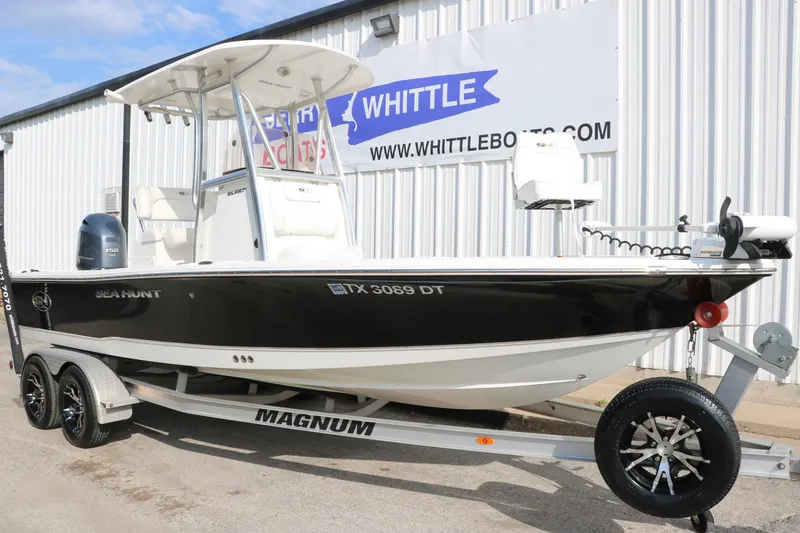 Slide: The Image of 2017 Sea Hunt BX22BR boat on trailer, parked outside Whittle Boats dealership. - 12