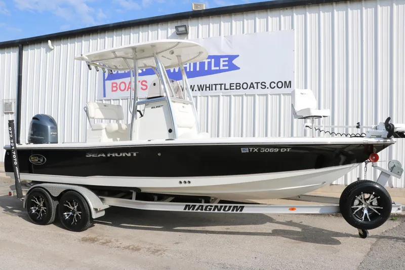 Slide: The Image of 2017 Sea Hunt BX22BR boat on trailer outside Whittle Boats dealership. - 13