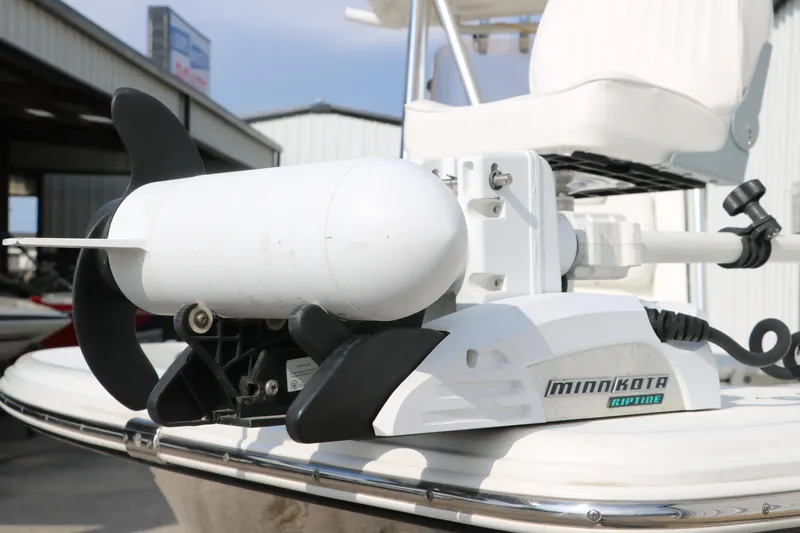 Slide: The Image of Minn Kota Riptide motor on 2017 Sea Hunt BX22BR boat, docked outdoors. - 15