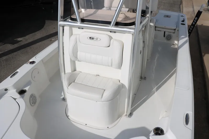 Slide: The Image of 2017 Sea Hunt BX22BR boat interior with white seating and console. - 20