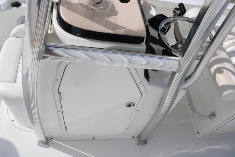Slide: The Image of 2017 Sea Hunt BX22BR boat console with stainless steel railings and storage compartment. - 21