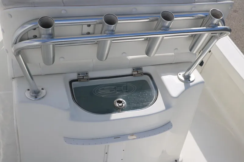 Slide: The Image of 2017 Sea Hunt BX22BR boat console with rod holders and storage compartment. - 26