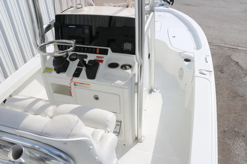 Slide: The Image of 2017 Sea Hunt BX22BR boat interior with steering console and seating. - 27