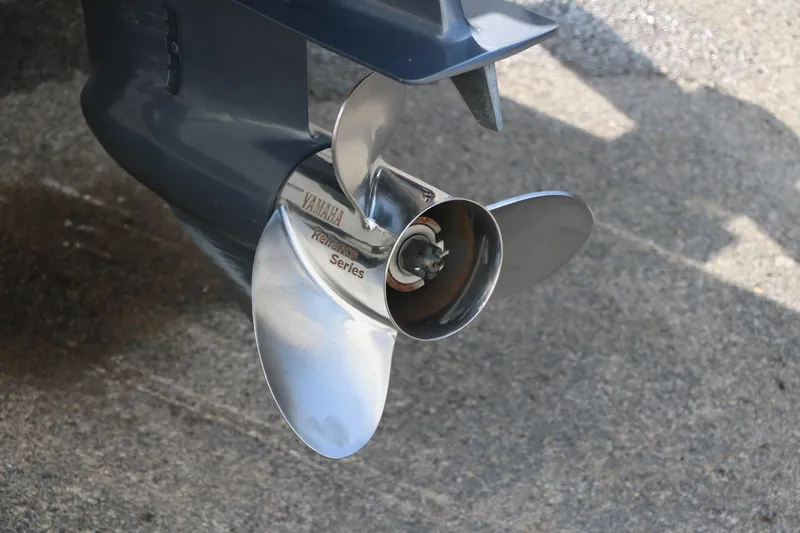 Slide: The Image of 2017 Sea Hunt BX22BR boat propeller on concrete surface. - 7