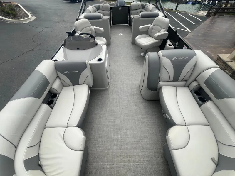 Slide: The Image of 2019 Starcraft EXS 3 pontoon boat with spacious seating and modern design. - 10