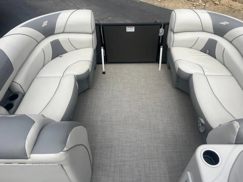 Slide: The Image of 2019 Starcraft EXS 3 pontoon boat interior with gray seating and flooring. - 12