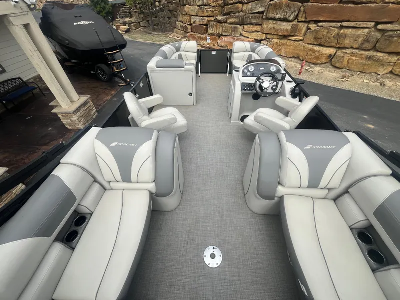 Slide: The Image of 2019 Starcraft EXS 3 pontoon boat with spacious seating and modern interior design. - 15
