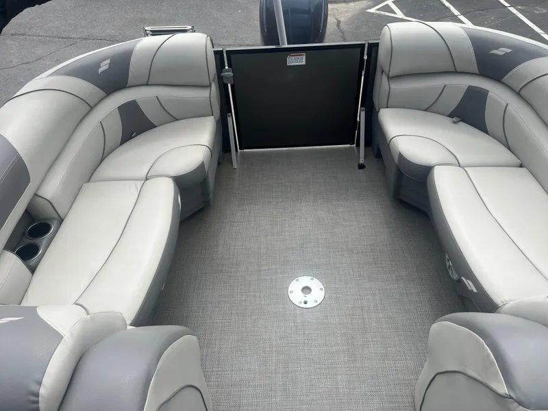 Slide: The Image of 2019 Starcraft EXS 3 boat interior with gray seating and carpeted floor. - 18