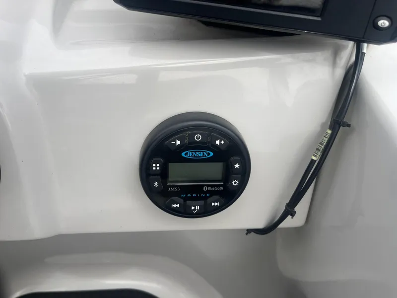 Slide: The Image of Jensen Bluetooth stereo system on 2019 Starcraft EXS 3 boat dashboard. - 8