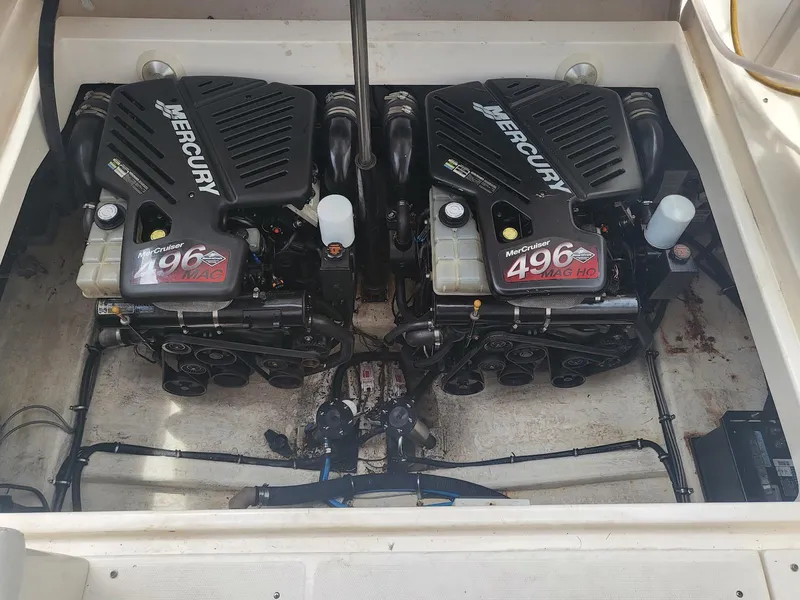 Slide: The Image of Twin Mercury 496 engines in a 2002 Wellcraft 38 Excalibur boat. - 14