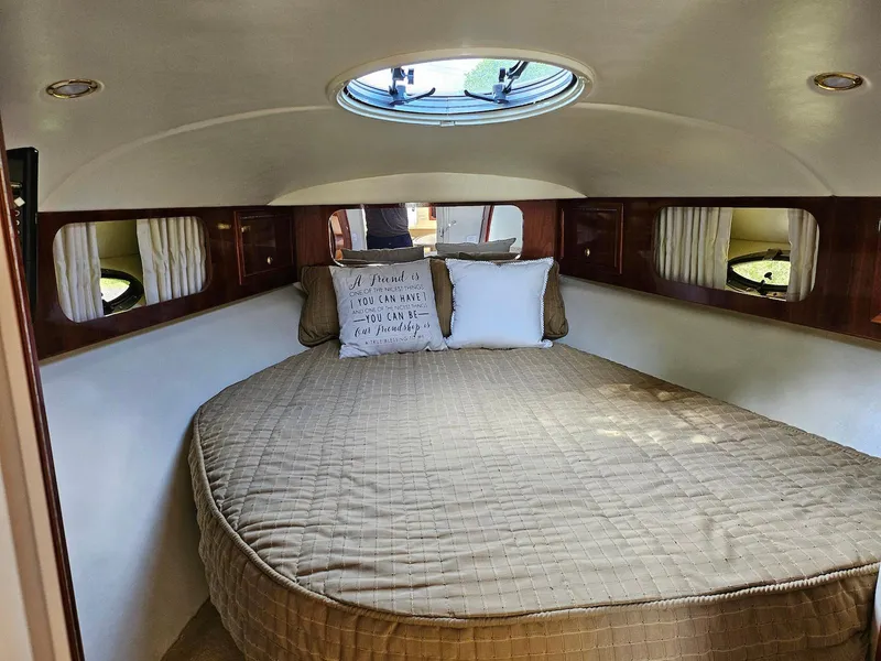 Slide: The Image of Cozy cabin interior of 2002 Wellcraft 38 Excalibur with round bed and skylight. - 3