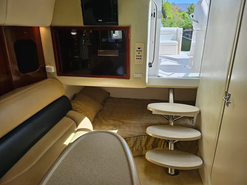 Slide: The Image of Interior of 2002 Wellcraft 38 Excalibur boat with cozy cabin and modern amenities. - 5