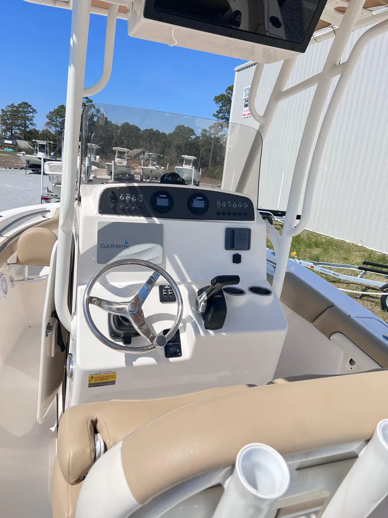 Slide: The Image of 2019 Pioneer 202 Islander boat dashboard with steering wheel and Garmin navigation system. - 3