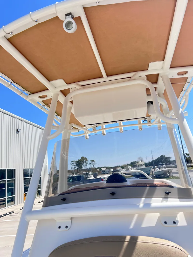 Slide: The Image of 2019 Pioneer 202 Islander boat with T-top and clear blue sky background. - 7