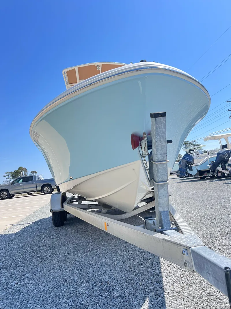 Slide: The Image of 2019 Pioneer 202 Islander boat on trailer under clear blue sky. - 9