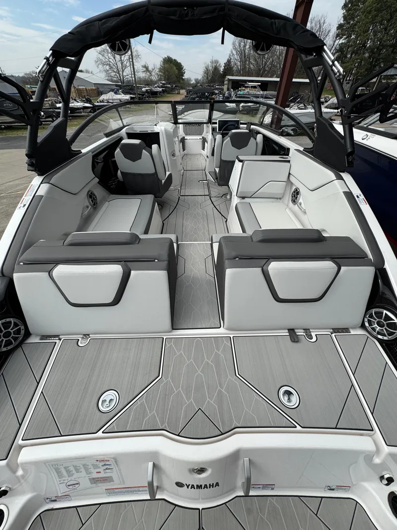 Slide: The Image of 2024 Yamaha Boats 252XE interior, featuring sleek seating and modern design elements. - 3