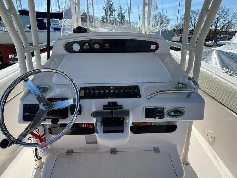 Slide: The Image of Grady-White Bimini 306 boat console, 2000 model, featuring steering wheel and control panel. - 12