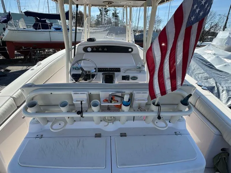 Slide: The Image of 2000 Grady-White Bimini 306 boat interior with American flag and fishing gear. - 14