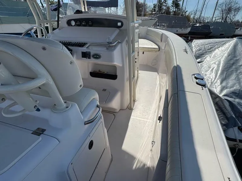 Slide: The Image of 2000 Grady-White Bimini 306 boat interior with helm and seating area. - 15