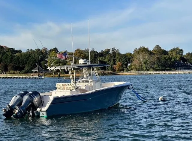 Slide: The Image of Grady-White Bimini 306 boat from 2000 moored on a calm lake with scenic background. - 2