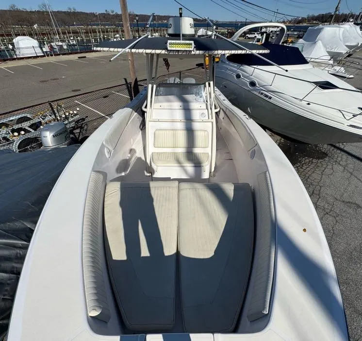 Slide: The Image of 2000 Grady-White Bimini 306 boat docked at a marina, top view. - 24