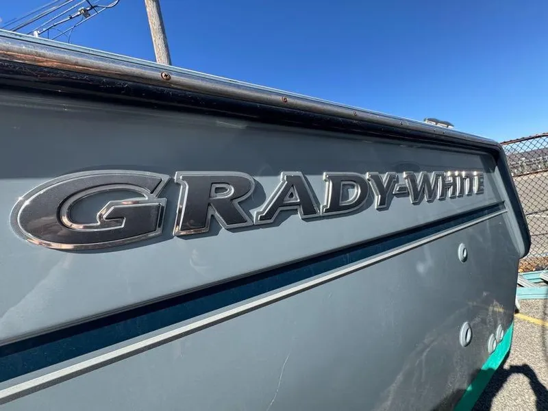 Slide: The Image of Grady-White Bimini 306 boat, 2000 model, close-up of logo on hull. - 30