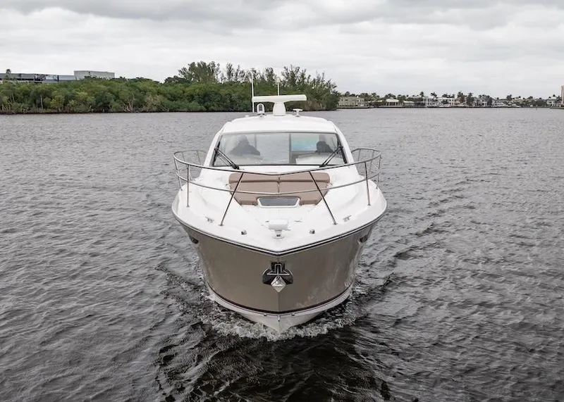 Slide: The Image of 2015 Pursuit SC 365i Sport Coupe cruising on a calm river under cloudy skies. - 10