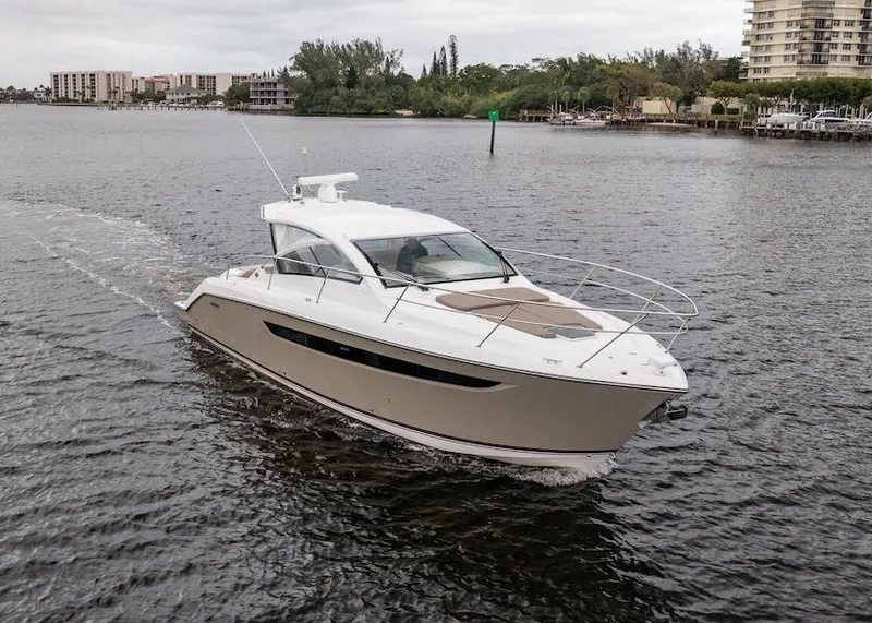 Slide: The Image of 2015 Pursuit SC 365i Sport Coupe cruising on a calm river. - 20