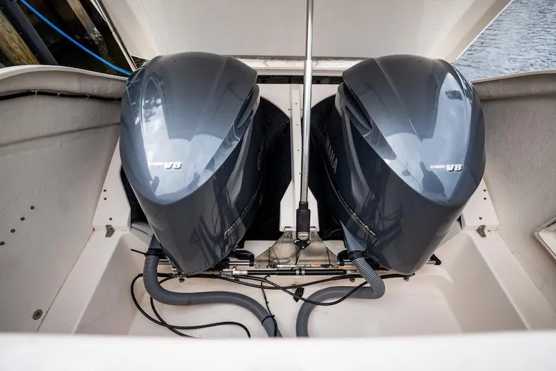 Slide: The Image of Twin Yamaha outboard engines on a 2015 Pursuit SC 365i Sport Coupe boat. - 23