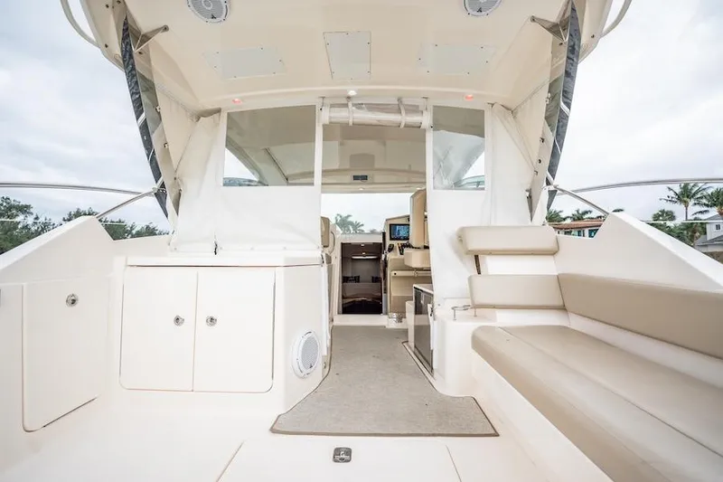 Slide: The Image of 2015 Pursuit SC 365i Sport Coupe interior with seating and helm view. - 30