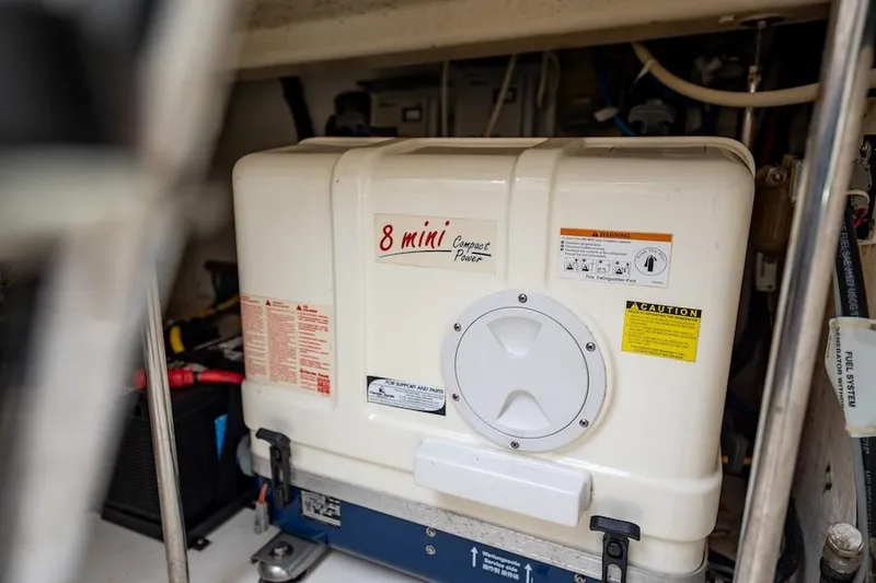 Slide: The Image of Engine compartment of a 2015 Pursuit SC 365i Sport Coupe with generator. - 47