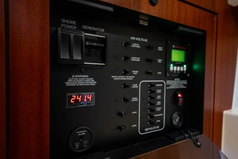 Slide: The Image of Electrical control panel of a 2015 Pursuit SC 365i Sport Coupe boat. - 48