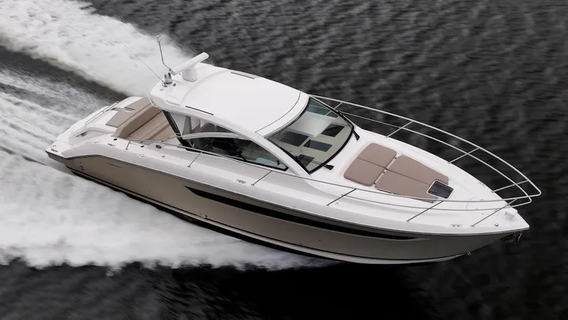 Slide: The Image of 2015 Pursuit SC 365i Sport Coupe cruising on water, showcasing sleek design and performance. - 5