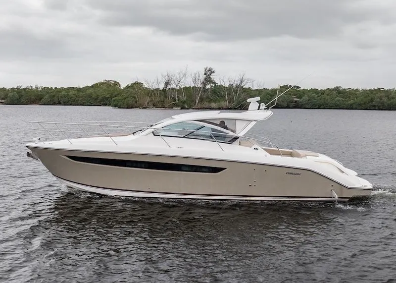 Slide: The Image of 2015 Pursuit SC 365i Sport Coupe cruising on a calm river under cloudy skies. - 7