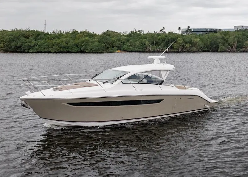 Slide: The Image of 2015 Pursuit SC 365i Sport Coupe cruising on a calm river. - 8