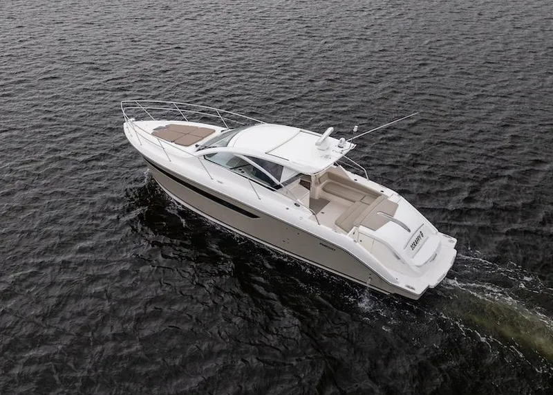 Slide: The Image of 2015 Pursuit SC 365i Sport Coupe cruising on open water. - 9