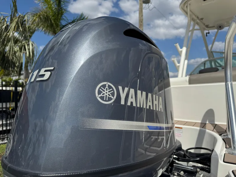 Slide: The Image of Yamaha outboard motor on 2022 World Cat 230 SD boat, with palm trees and blue sky background. - 17