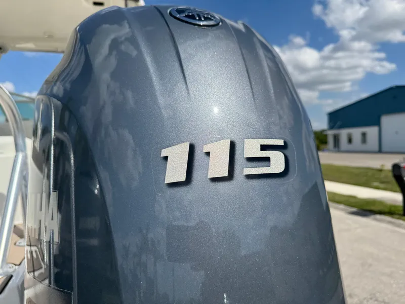 Slide: The Image of Yamaha 115 outboard motor on 2022 World Cat 230 SD boat, sunny day. - 18