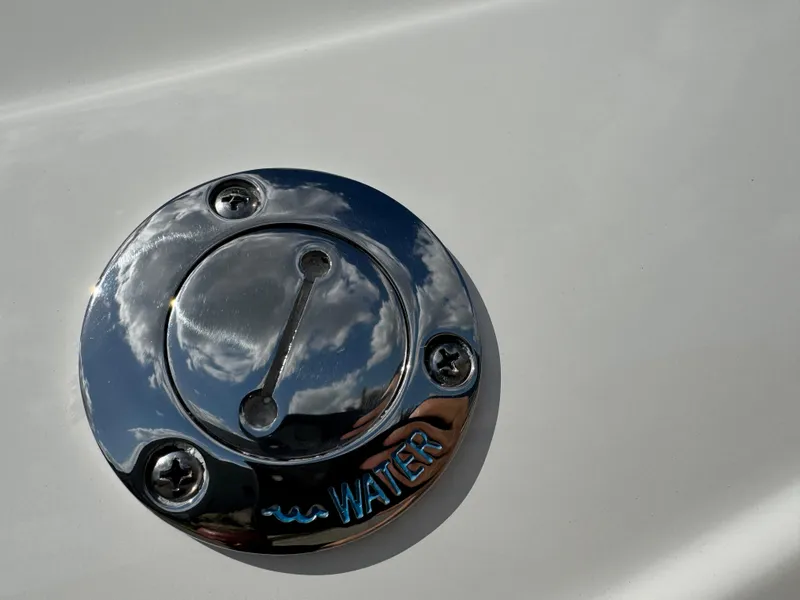 Slide: The Image of Chrome water cap on 2022 World Cat 230 SD boat, reflecting clouds. - 26