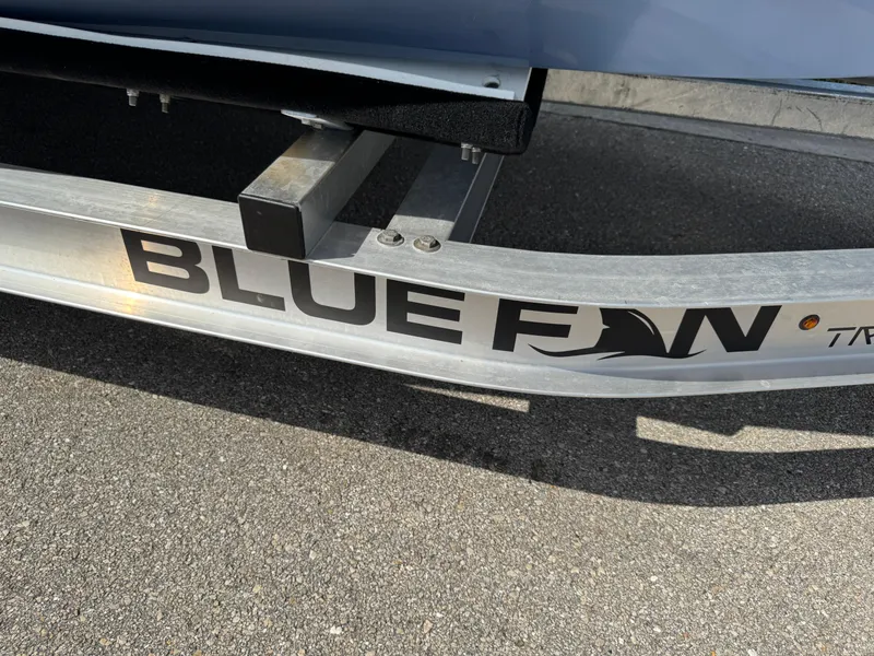 Slide: The Image of Boat trailer with "Blue Fin" logo, World Cat 230 SD, 2022 model. - 30