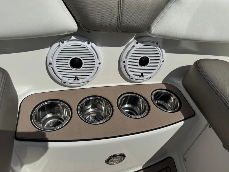 Slide: The Image of 2022 World Cat 230 SD boat interior with speakers and cup holders. - 32