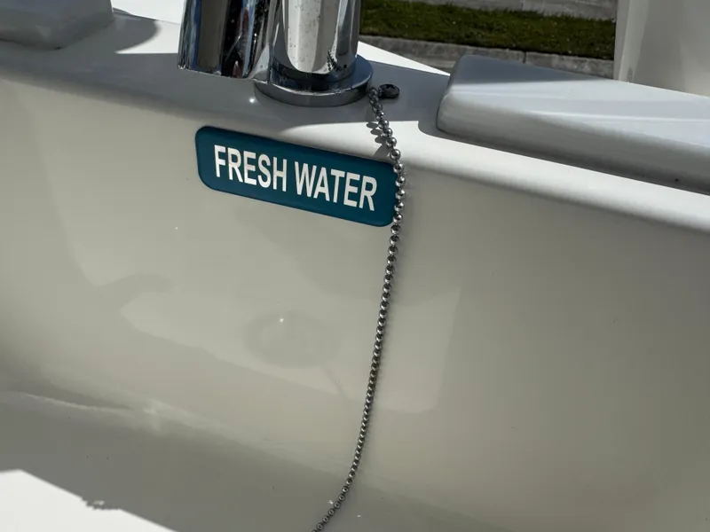 Slide: The Image of 2022 World Cat 230 SD boat with fresh water faucet and chain detail. - 40