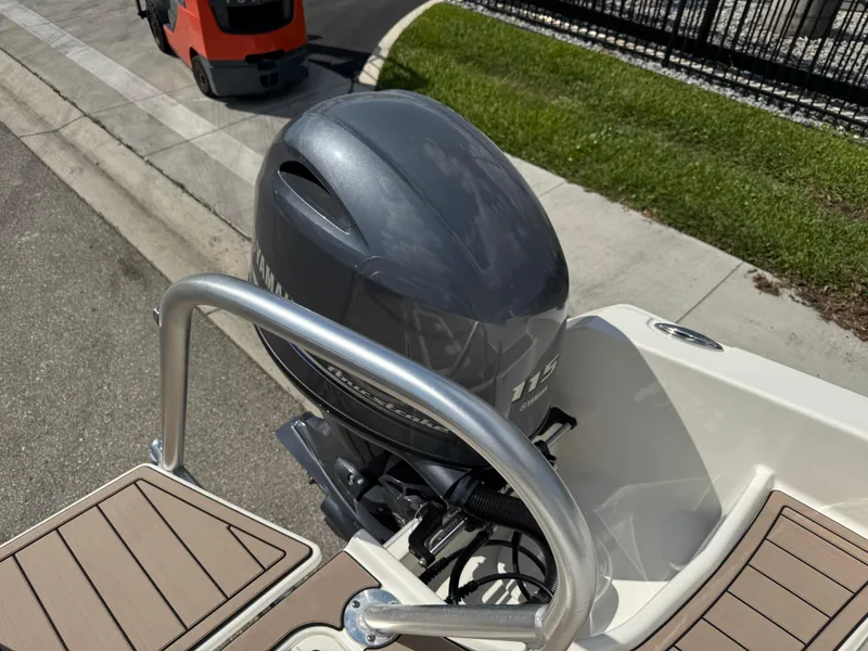 Slide: The Image of 2022 World Cat 230 SD boat with outboard motor, docked on a sunny day. - 41