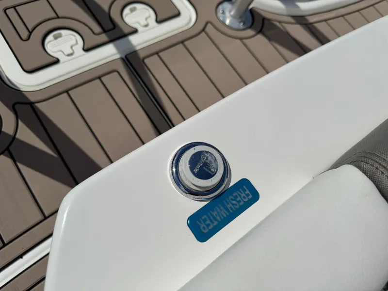 Slide: The Image of 2022 World Cat 230 SD boat detail with fresh water button on deck. - 45